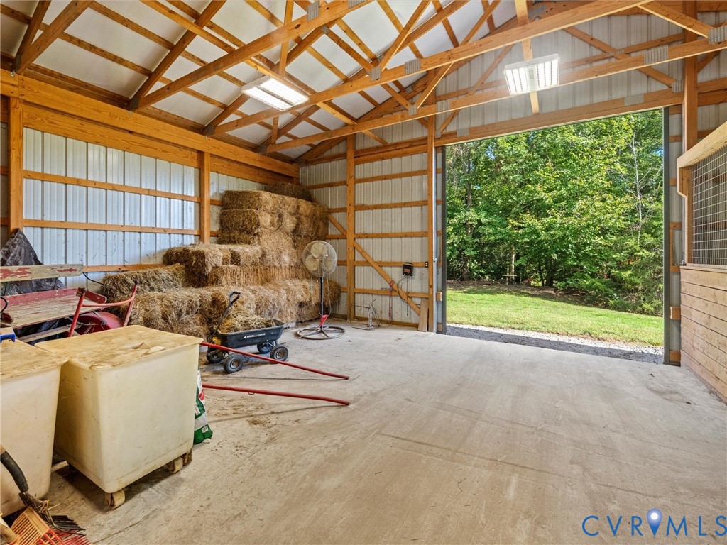 The spacious hay and storage area offers plenty of room for feed, hay, and equipment, with the potential to convert the space into two additional horse stalls. A versatile feature that allows the barn to grow with your equestrian needs!