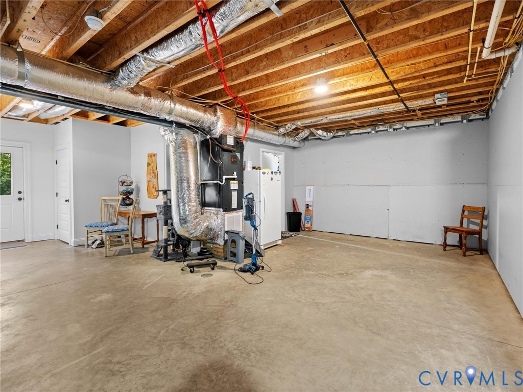 The partially finished walk-out basement is heated and cooled, offering generous space for a recreation room, home gym, workshop, or additional living area. A versatile space with endless possibilities!