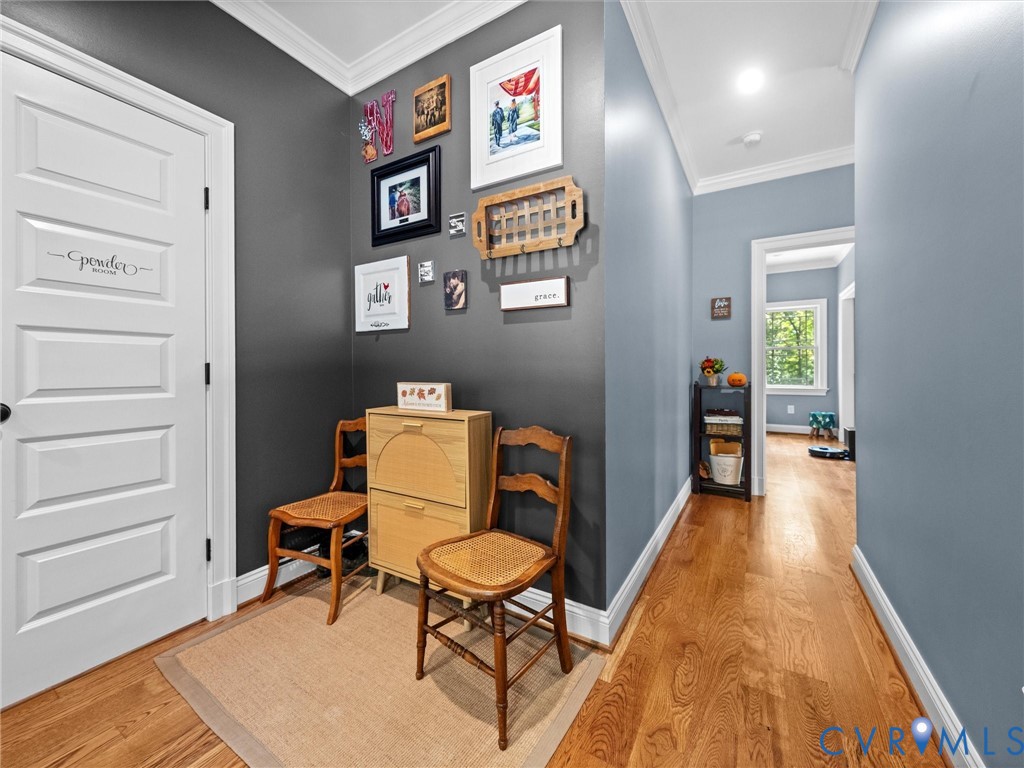 This versatile space just off the foyer features beautiful hardwood floors, stylish accent walls, and abundant natural light. A flexible area with endless possibilities to suit your needs!