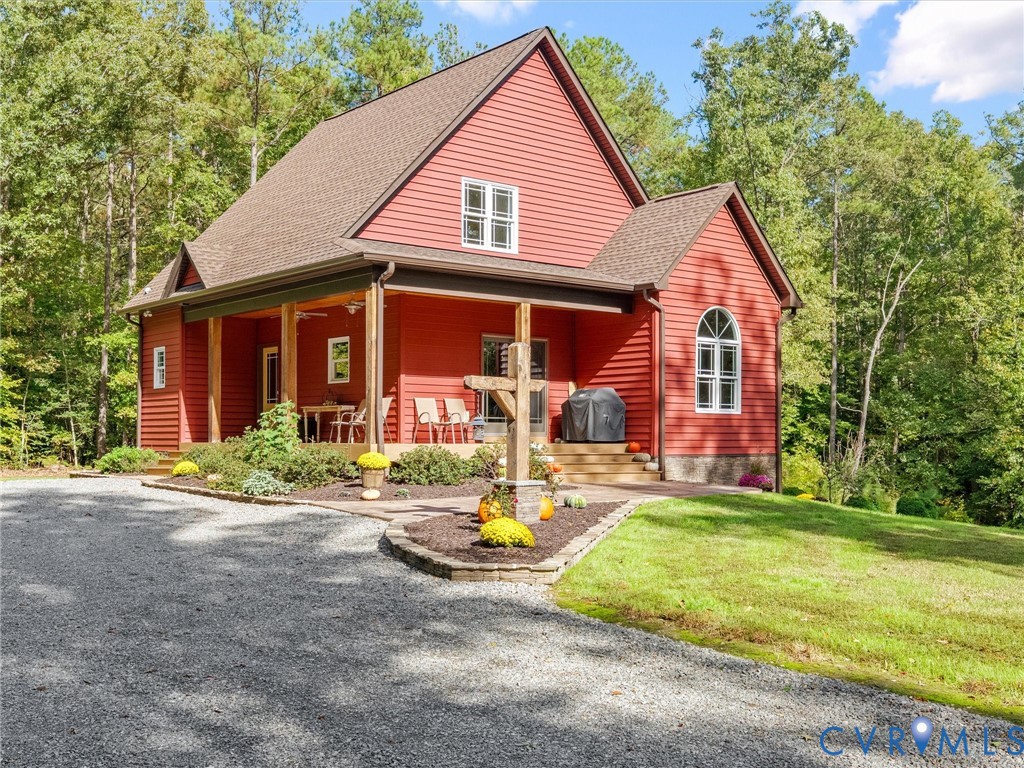Welcome to The Little Red Homestead! This charming custom-built home features striking red siding, inviting covered front porches with rustic white oak columns, beautiful landscaping, and a welcoming country setting surrounded by mature trees. The perfect blend of farmhouse charm and peaceful country living! Welcome to The Little Red Homestead! This charming custom-built home features striking red siding, inviting covered front porches with rustic white oak columns, beautiful landscaping, and a welcoming country setting surrounded by mature trees. The perfect blend of farmhouse charm and peaceful country living!