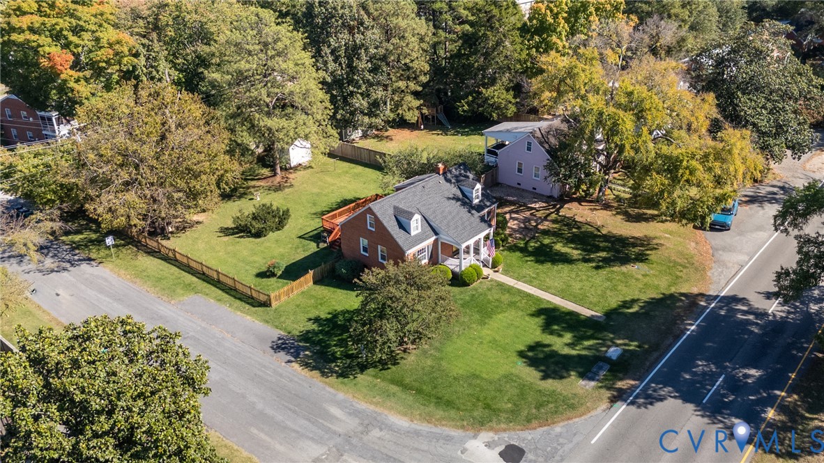 Ariel view of the corner lot, fully fenced in backyard, and off street parking available from Stillwell Rd. Ariel view of the corner lot, fully fenced in backyard, and off street parking available from Stillwell Rd.
