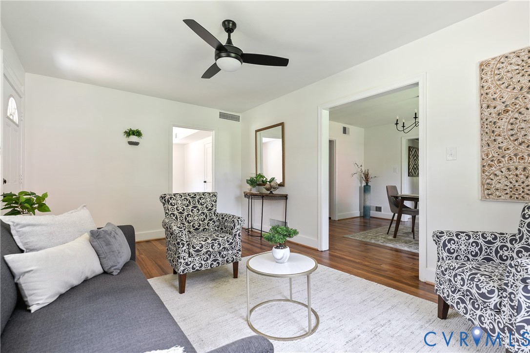 Hardwood flooring throughout living area and dining room