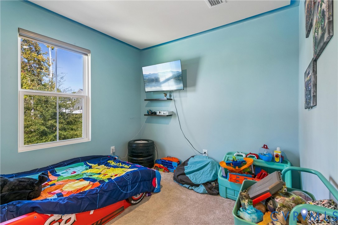Single-hung window with white frame, wall-mounted floating shelving, and neutral carpeting