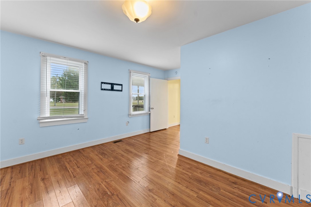 Primary Bedroom with laminate flooring.