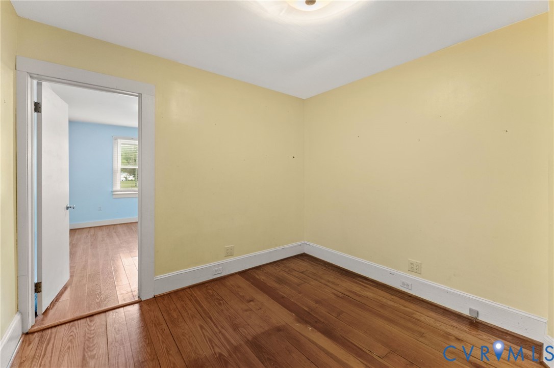 3rd downstairs Bedroom with pine floors.