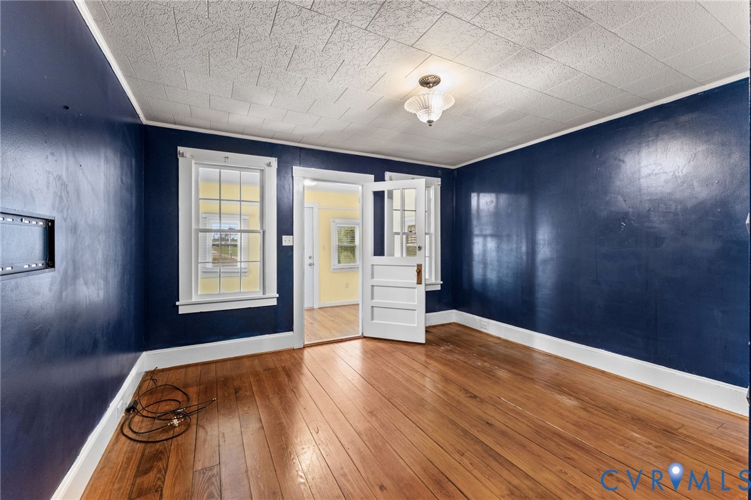 Formal Living Room with lovely pine floors.