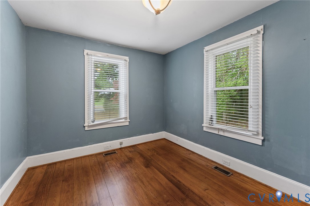 2nd downstairs Bedroom with lovely pine floors.