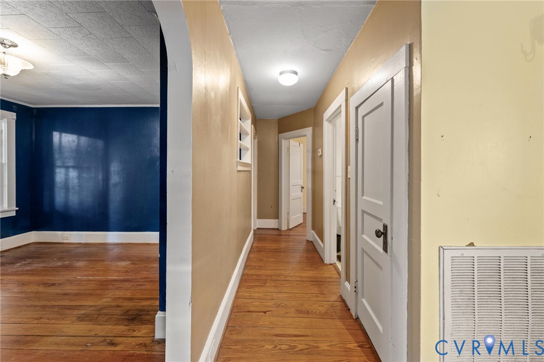 Hallway with pine floors.