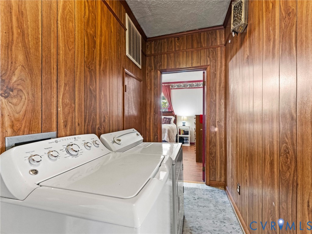 Wood-paneled walls and textured ceiling finish