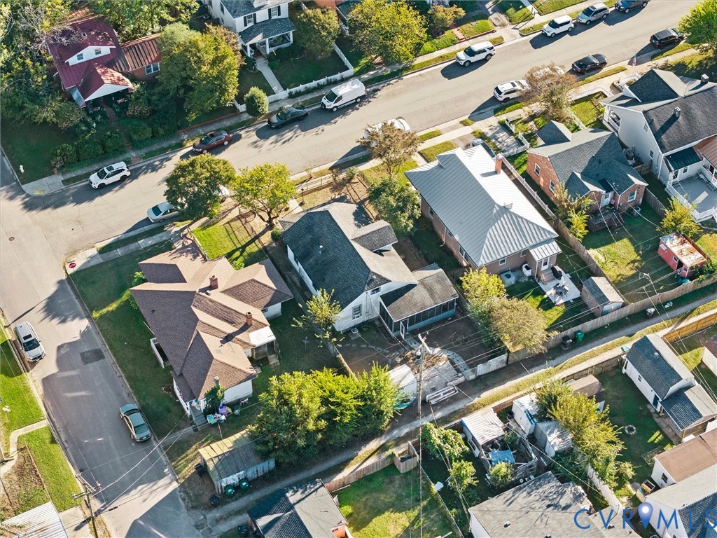 Aerial perspective of neighborhood featuring mature trees