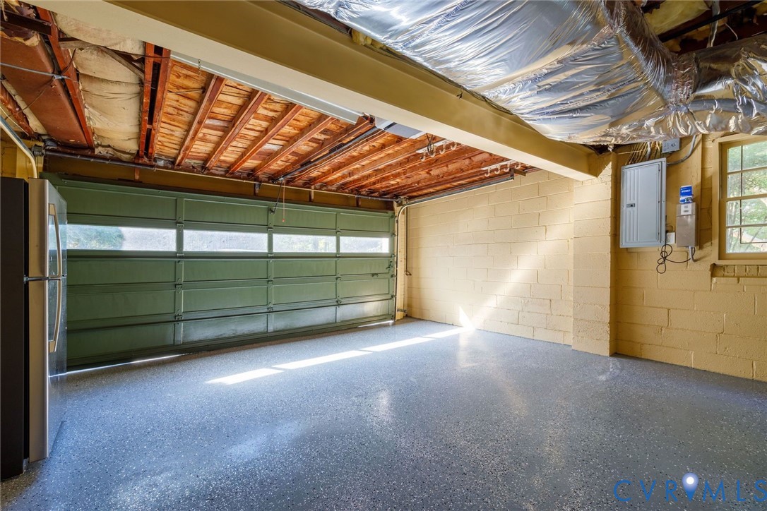 Two car garage with newly sealed floor and bonus mechanical room.