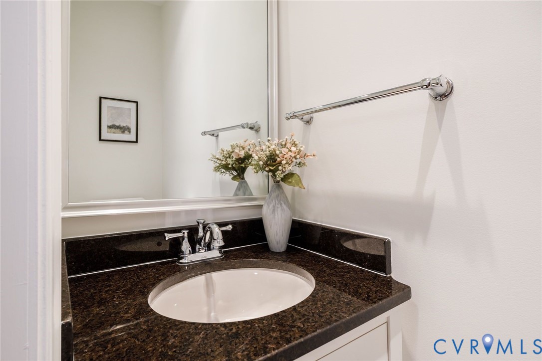 First floor powder room with granite counters.