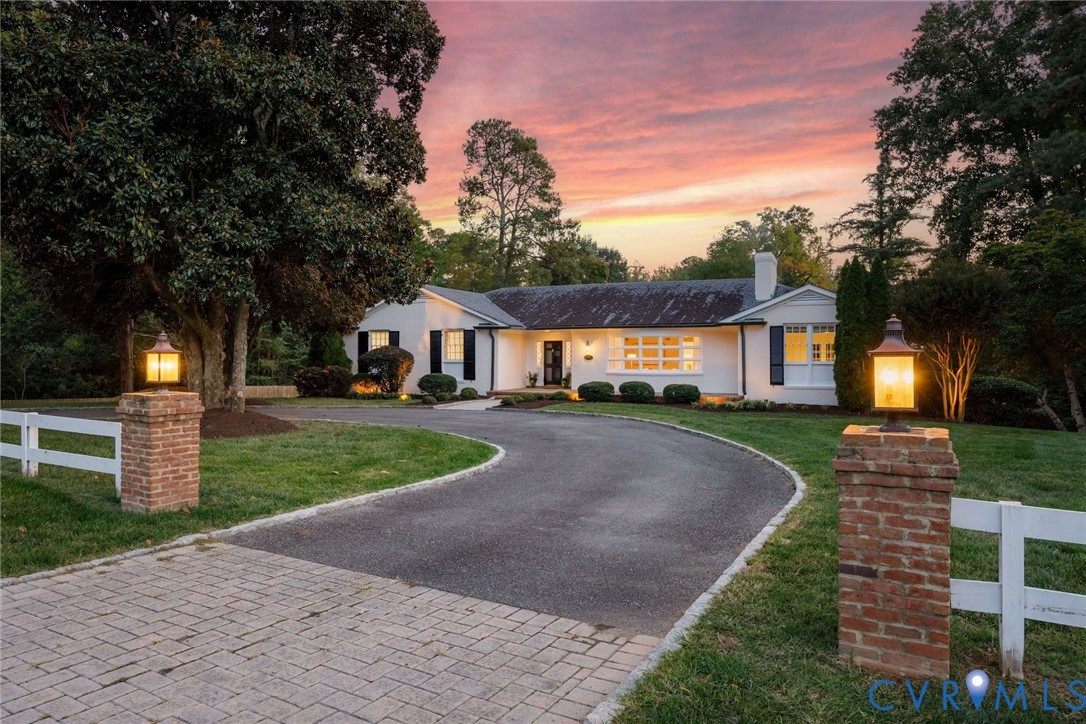 The stunning 1.14 acre property enjoys easy access from River or another driveway off Country Squire Lane.