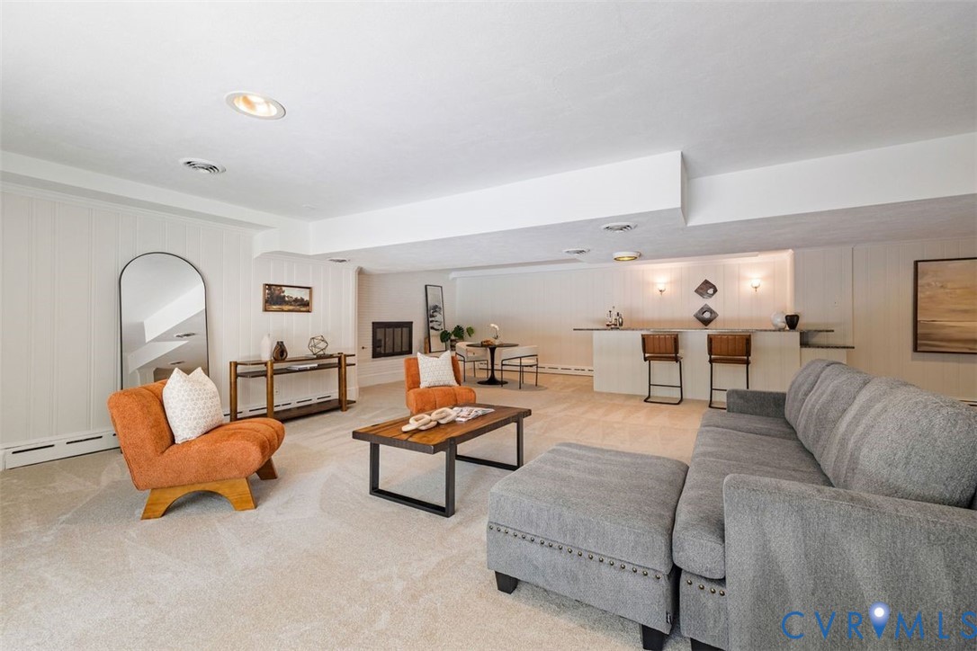 The full walk out basement boasts nearly 1,000 SF of entertaining space with a lounge, wet bar and fireplace.