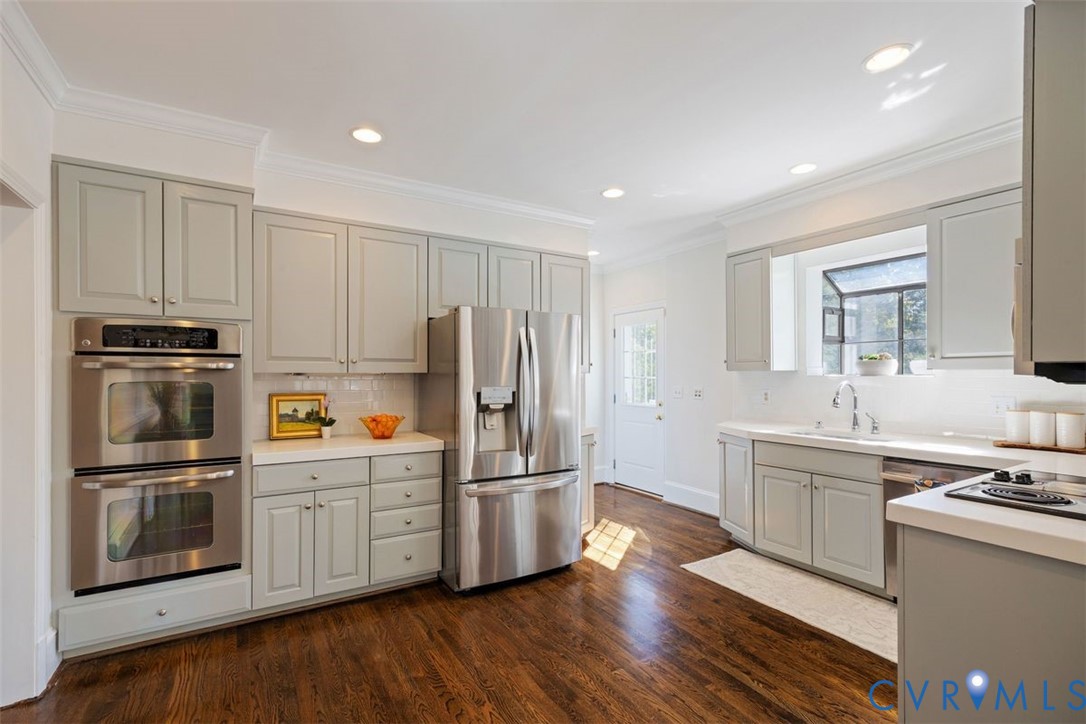 Fresh palette, hardwoods and excellent natural light in this timeless kitchen.