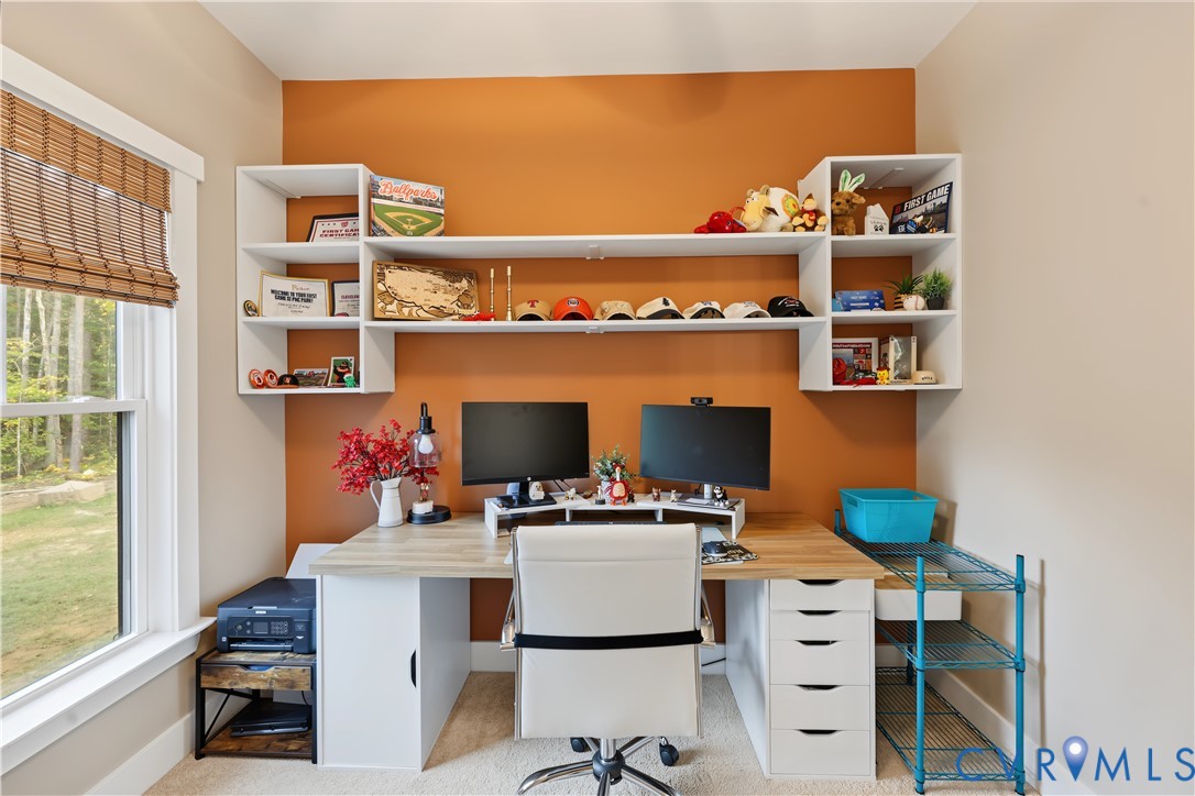Built-in white wall shelving with a multi-tiered configuration and a window featuring a natural woven shade