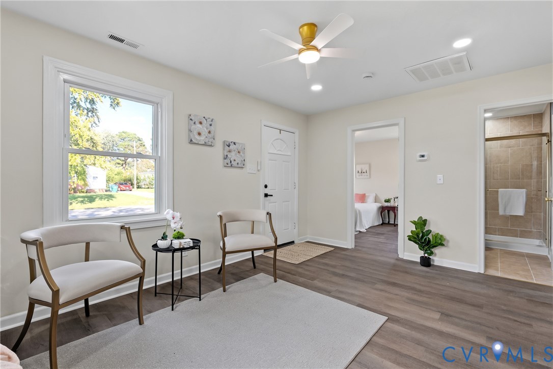 Wood-finish flooring, recessed lighting, ceiling fan with light fixture, and dual interior entryways Wood-finish flooring, recessed lighting, ceiling fan with light fixture, and dual interior entryways