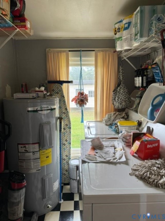 Utility room featuring a window with exterior exposure, wire shelving units, and checkerboard-patterned flooring Utility room featuring a window with exterior exposure, wire shelving units, and checkerboard-patterned flooring