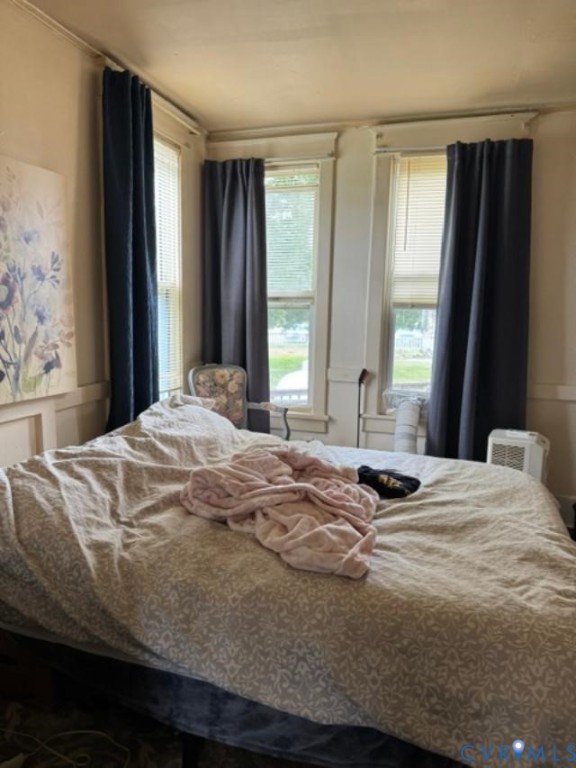 Dual window configuration featuring traditional millwork trim and inset window treatments