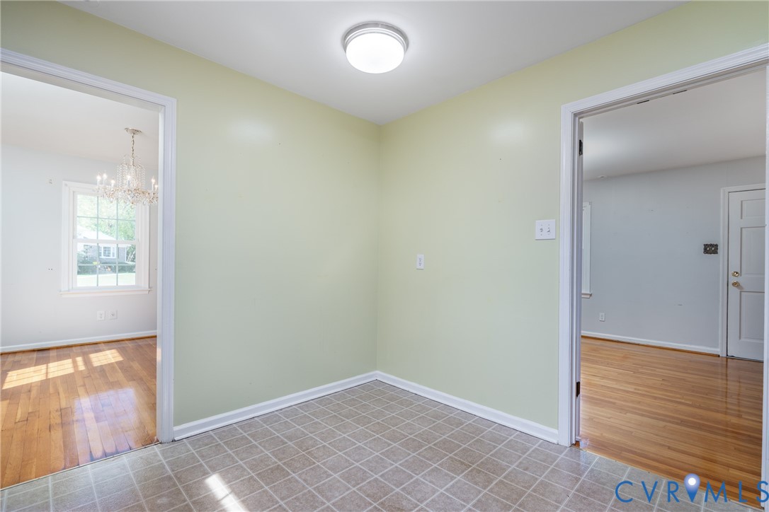 Interior space featuring grid-pattern tile flooring and a flush-mount overhead light fixture