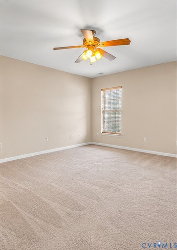 Neutral wall coloring, wall-to-wall carpeting, window with wood-finish blinds, and a multi-light ceiling fan