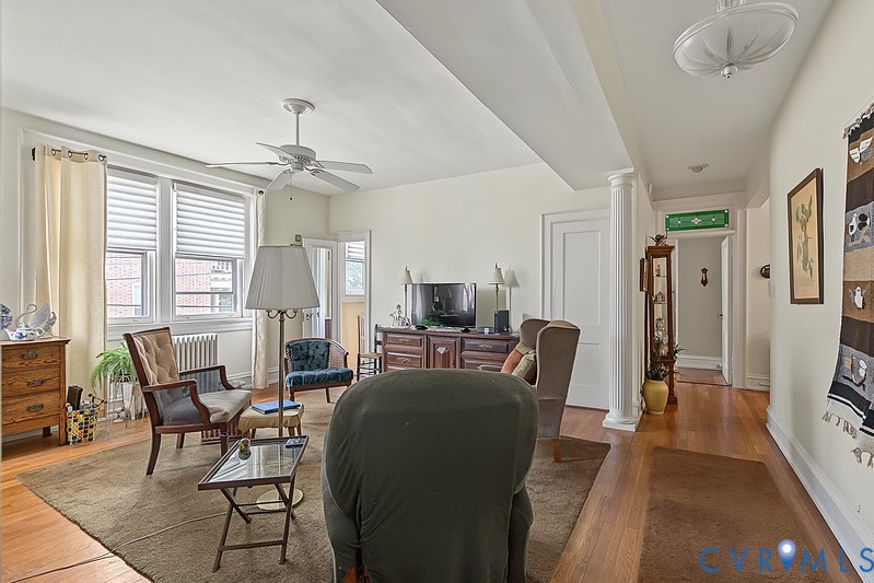 Hardwood floor, ceiling fan and attached bathroom.
