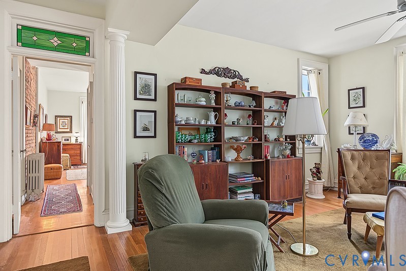 Hardwood floor, closet, ceiling fan.