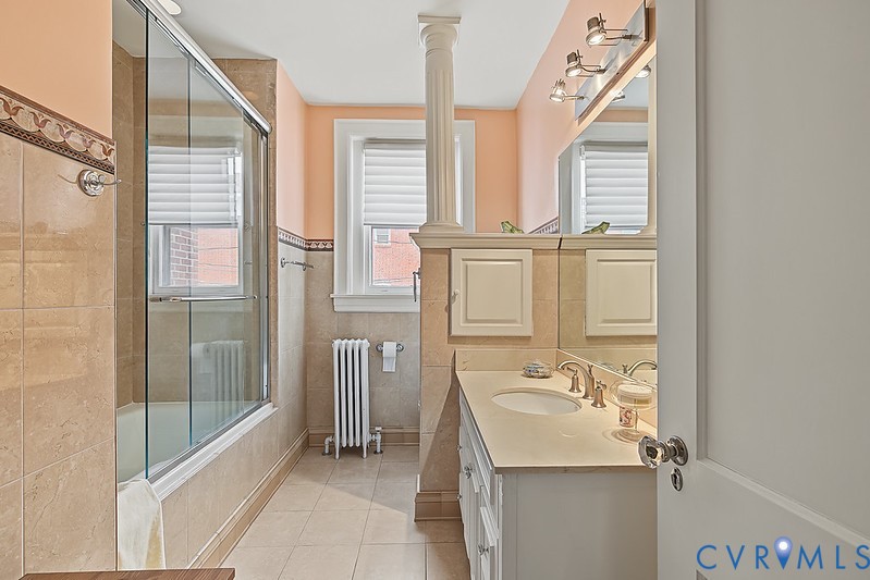 Hall bath with shower and tub.