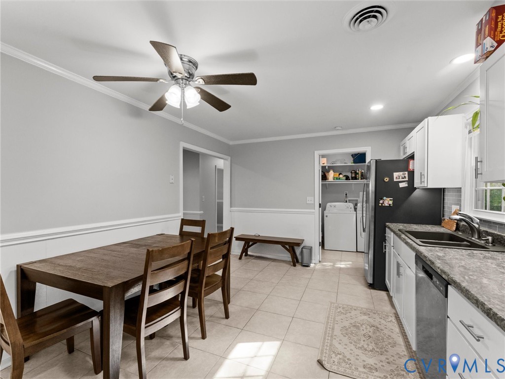 Kitchen featuring white cabinetry, stone-patterned countertops, a stainless steel dishwasher, tile flooring, and a ceiling fan
