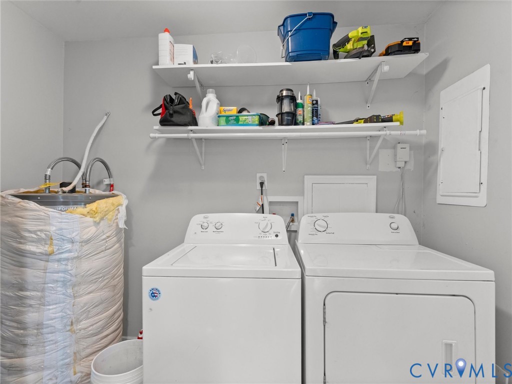 Dedicated utility space featuring dual wall-mounted storage shelves and a built-in hanging rod