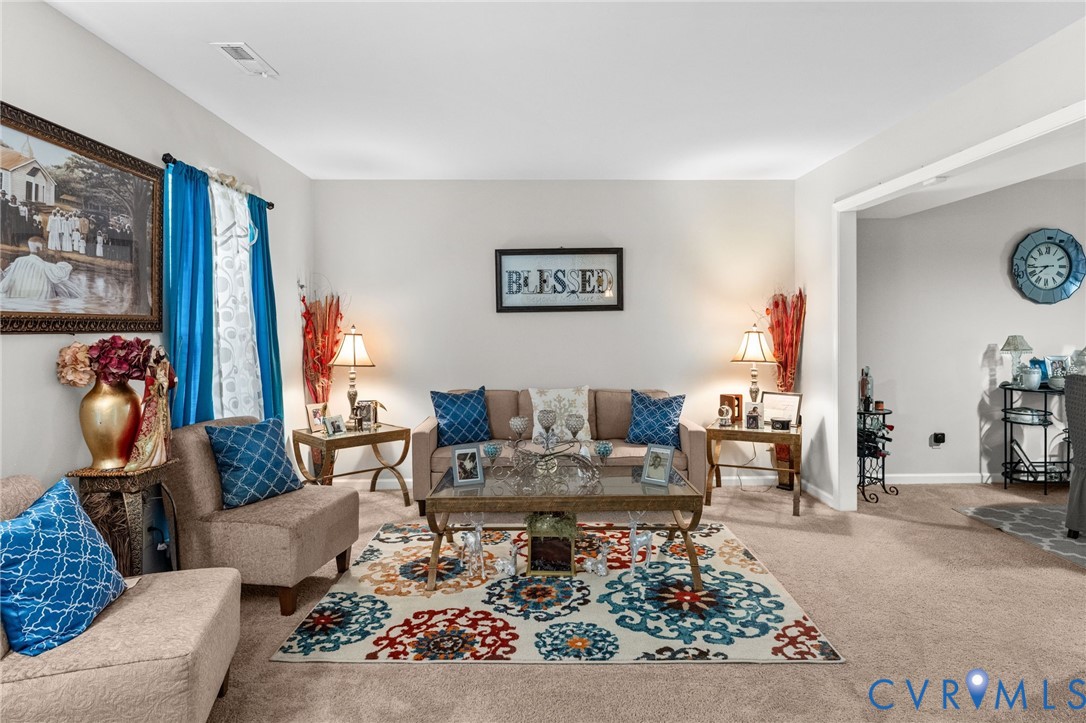 Neutral wall paint, plush carpeting, and expansive open-concept layout