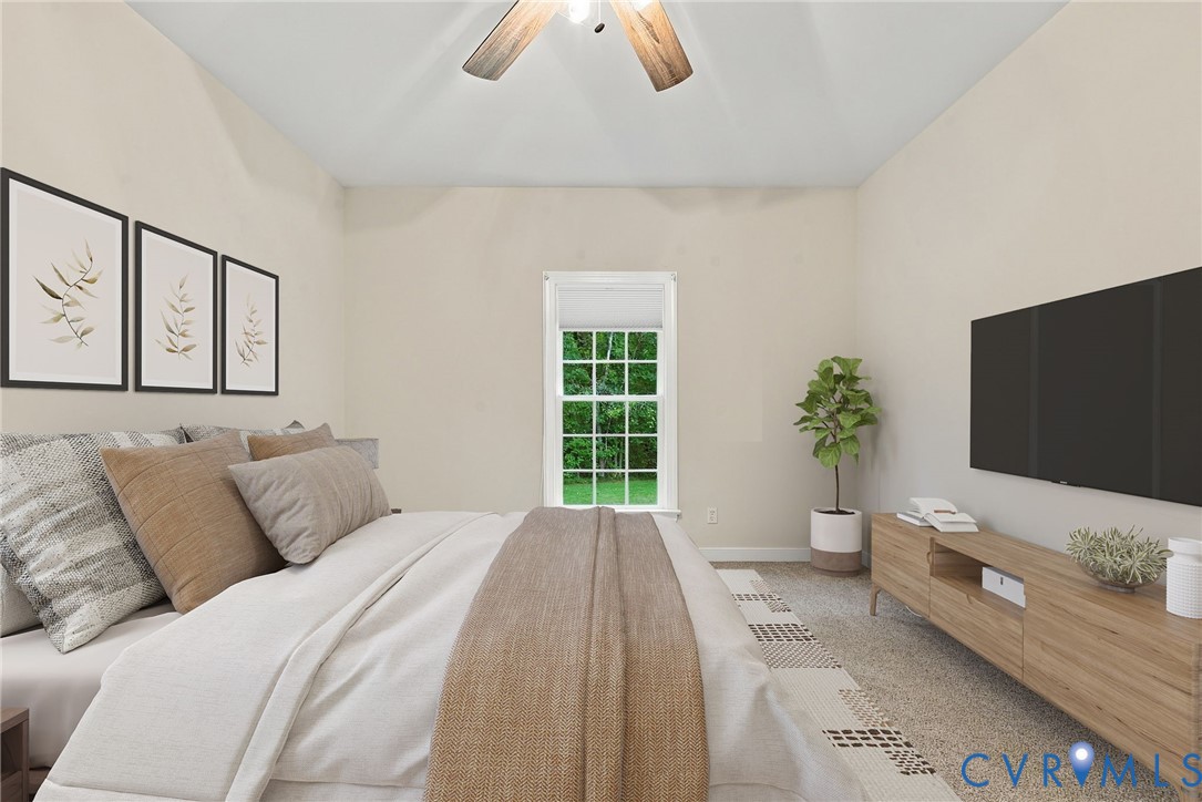 Guest bedroom with neutral paint and ceiling fan. Virtually staged concept