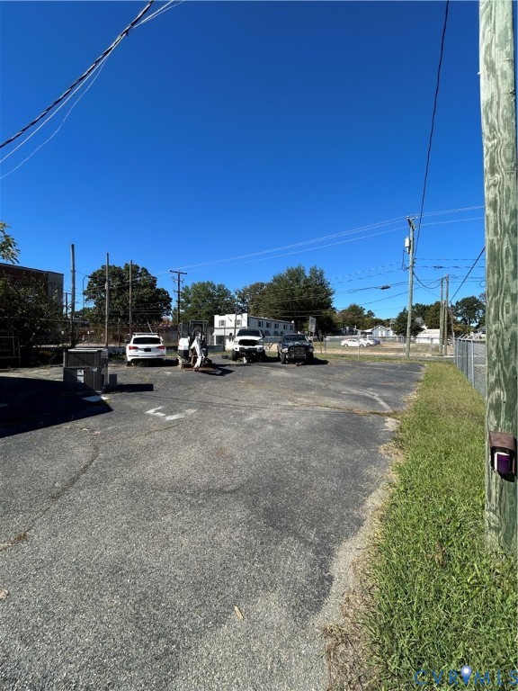 Asphalt paved surface with chain-link perimeter fencing
