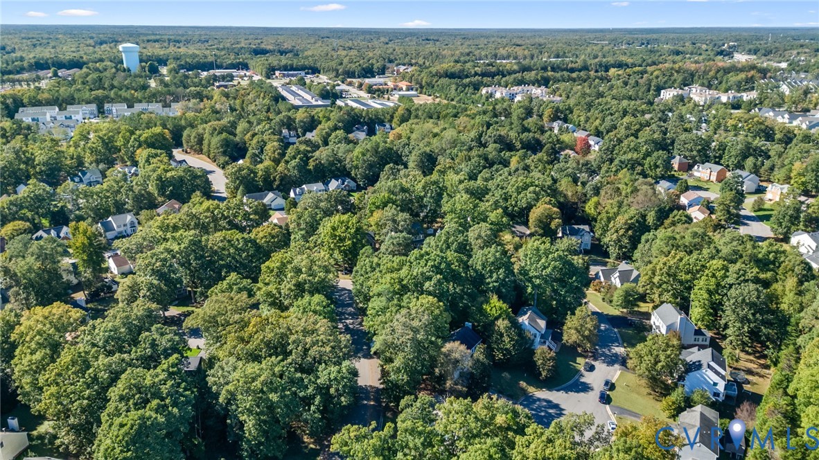 Aerial perspective featuring dense canopy coverage, established residential infrastructure, and expansive mature greenery