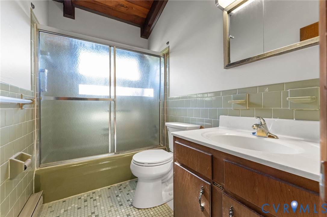 Hall ceramic tiled Bath with tub & shower.