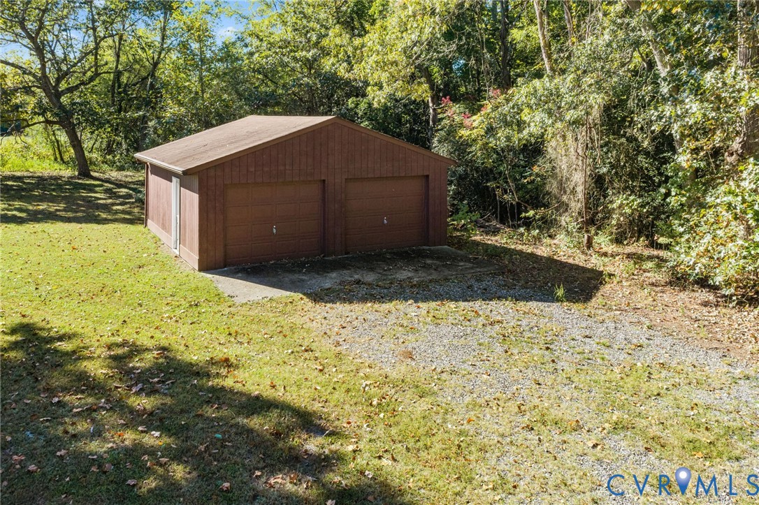 Detached 2-Car Garage with wood siding.
