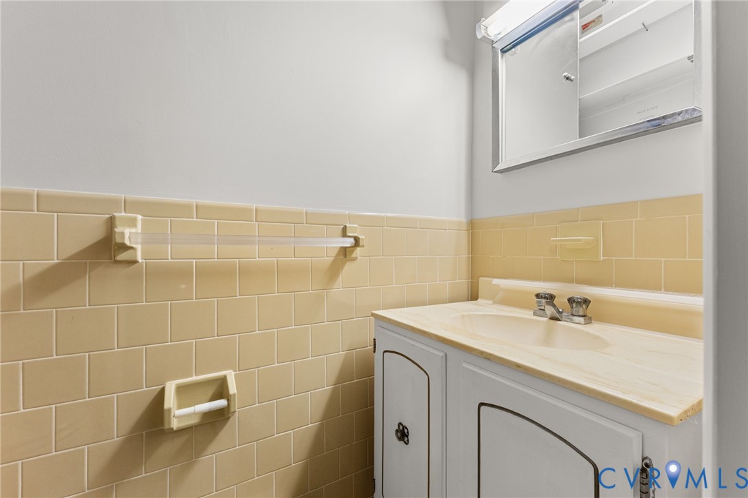 Ceramic half bath in Primary Bedroom.