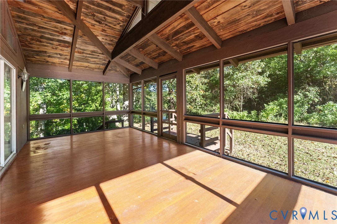 12' X 24' Screen Porch with exposed beams & wood floors. View of Creek from Porch.