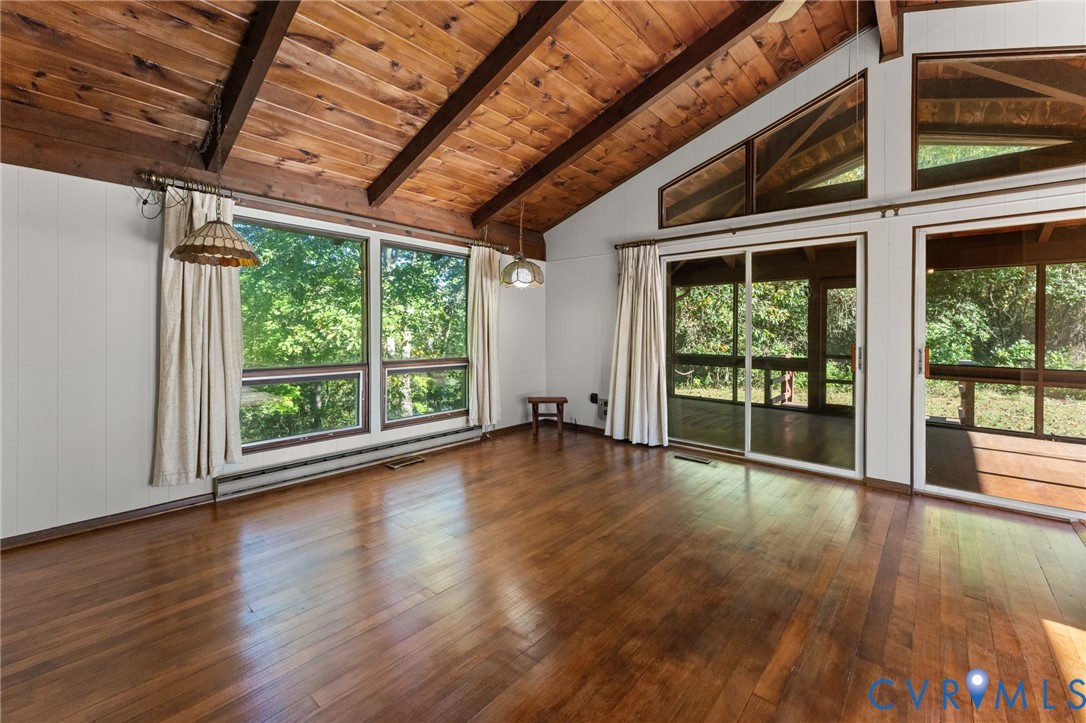 Additional view of Great Room showing sliding doors to big screen porch.