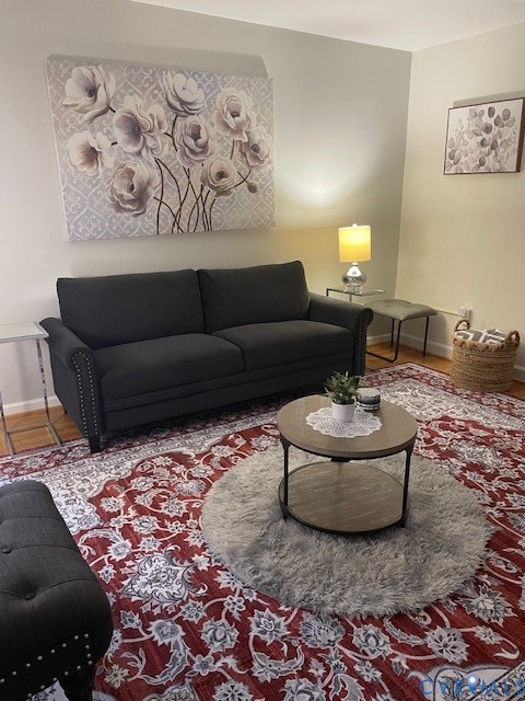 Interior space featuring wood-finish flooring and neutral-toned wall paint