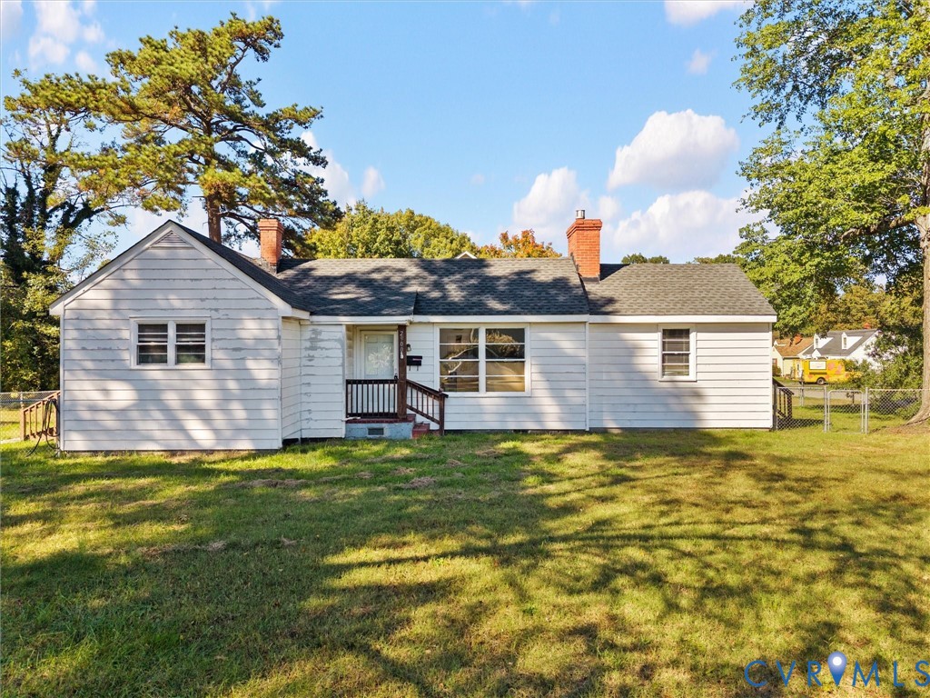 Single-story residence featuring horizontal siding, dual brick chimneys, a shingled roof, and a covered front entry