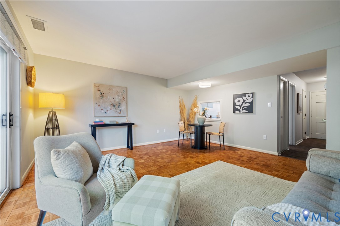 Parquet wood-finish flooring, sliding glass door, and interior pass-through window