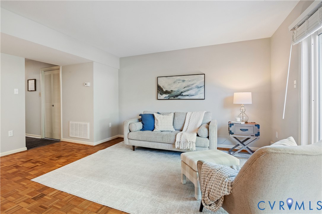 Parquet wood-finish flooring and neutral-toned wall paint