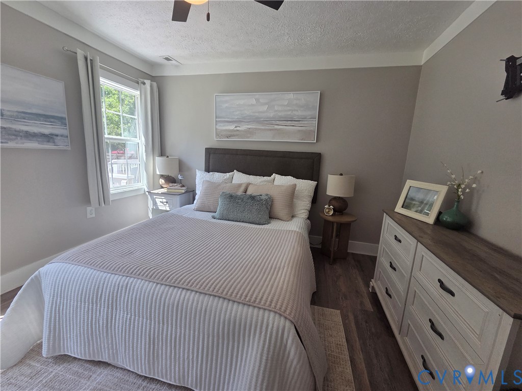 Wood-finish flooring, multi-pane window, and neutral wall tones
