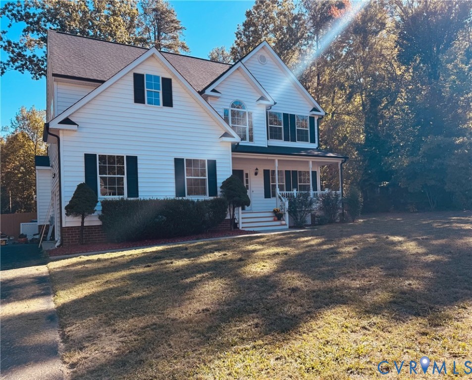 Professional Pictures - Coming Soon :  Two-story traditional exterior featuring horizontal white siding, a covered front porch with white railing, and dark-toned shutters