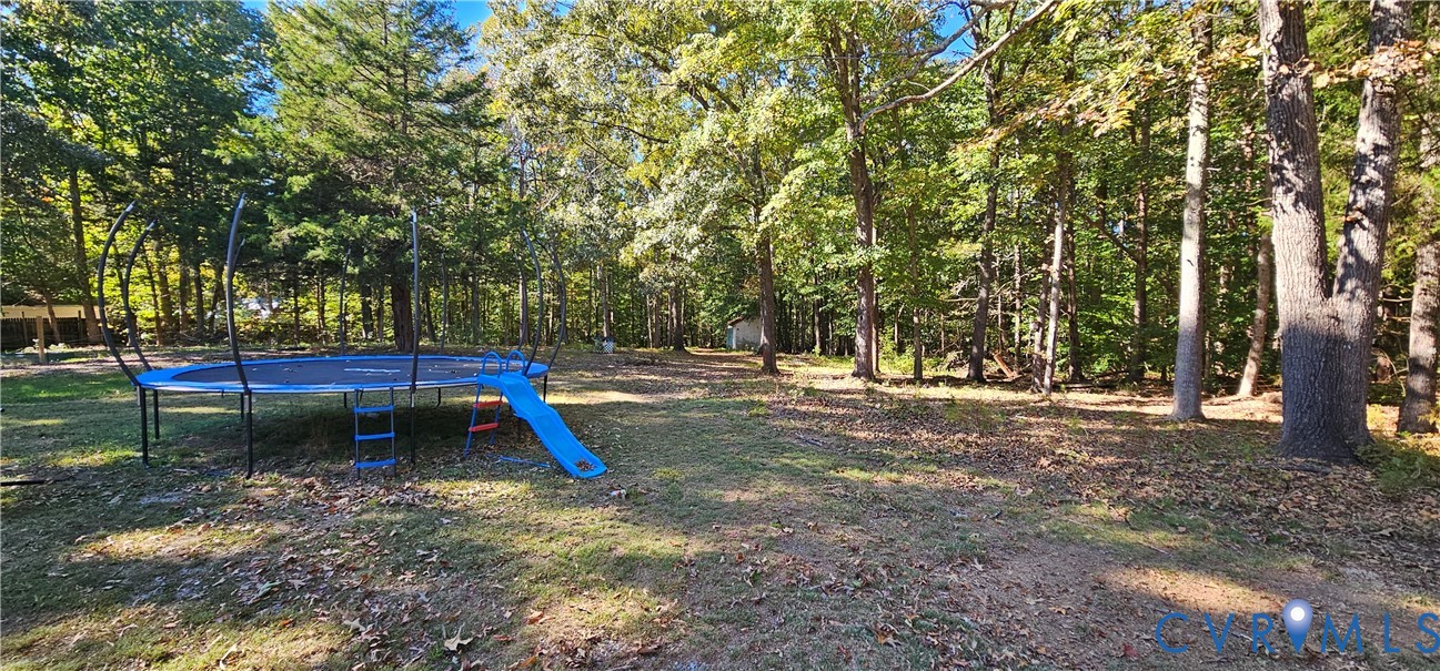 Expansive lot featuring mature hardwood trees and wooded perimeter