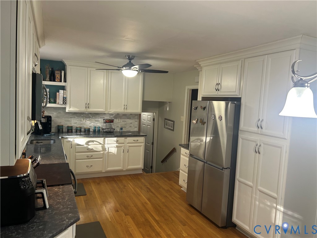 Kitchen with granite countertops, loads of counter and cabinet space plus built-in pantry.