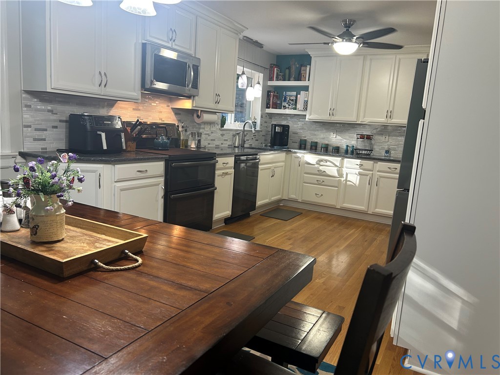 Kitchen with granite countertops, loads of counter and cabinet space plus built-in pantry.