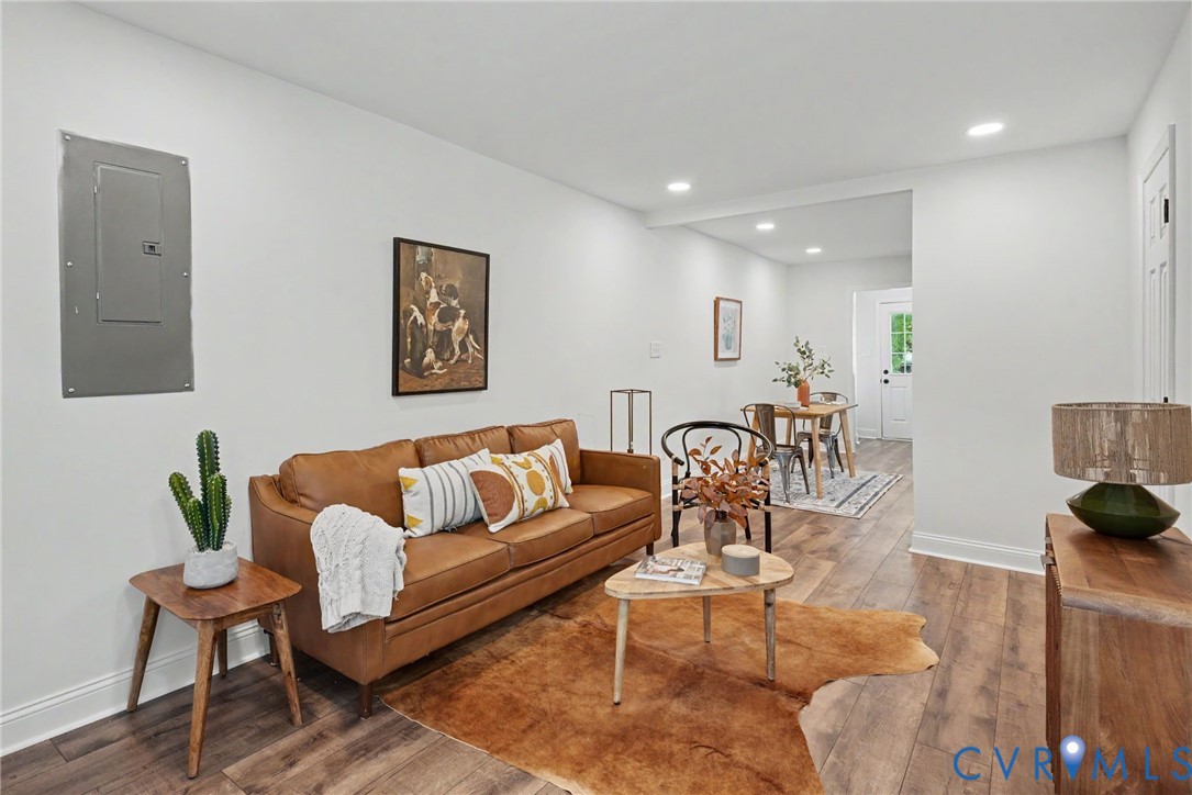 Neutral-toned interior featuring wood-finish flooring and recessed lighting