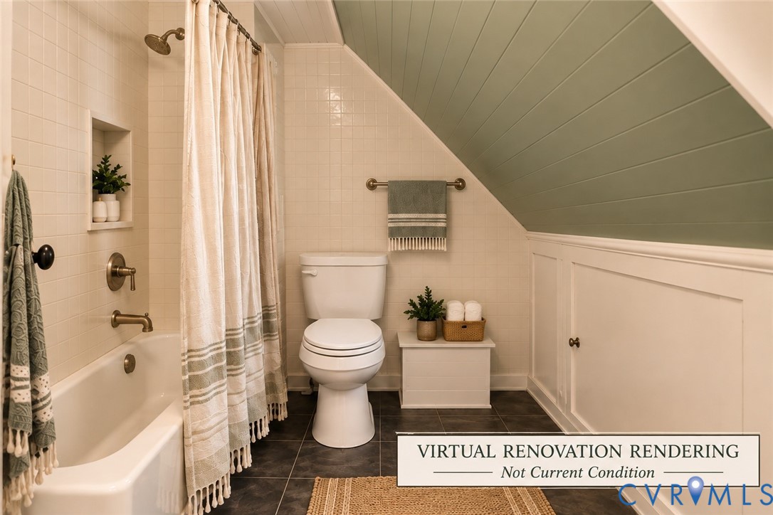 Bathroom featuring a sloped ceiling with horizontal wood paneling, tile-surround tub with built-in wall niche, brass-finish fixtures, and lower wall wainscoting